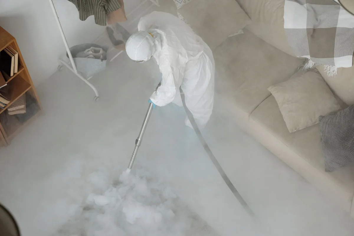 Biohazard cleanup technician in protective equipment, Cascade, IA